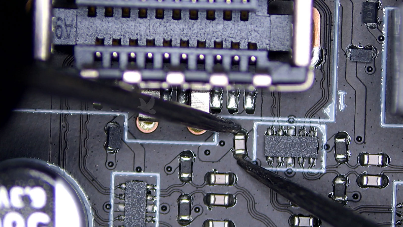 Testing a shorted capacitor near a connector in a damaged circuit area