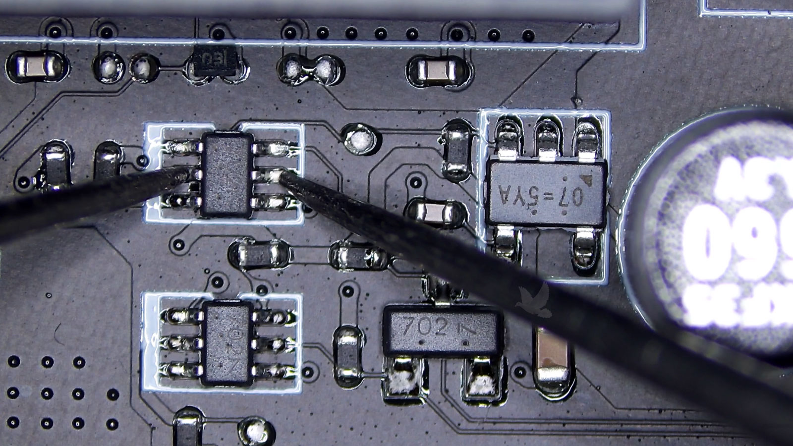 Testing a damaged transistor with a multimeter showing internal failure