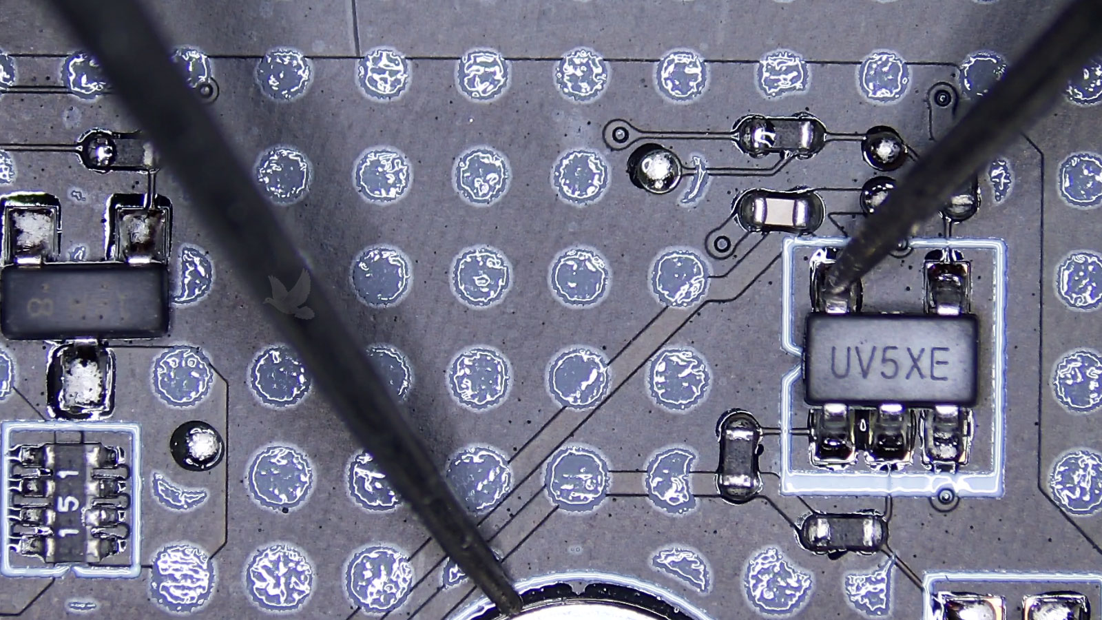 Measuring the UV5XE IC pin shorted to ground on a circuit board