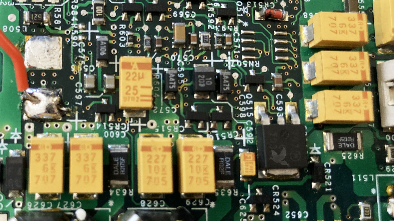 Wire soldered to circuit board pad for voltage injection during component diagnosis