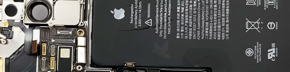 Partially disassembled iPhone with battery disconnected and internal connectors removed during restoration